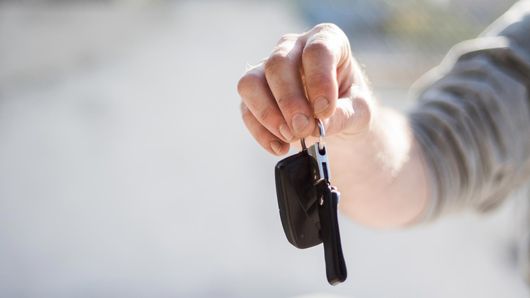 Car keys being given to the new owner